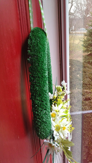 wreath hanging flat on door