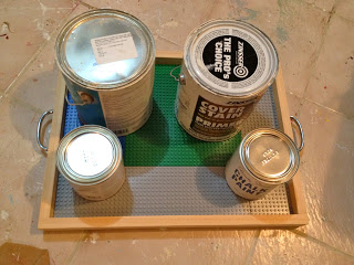 paint cans on baseplates to hold while drying
