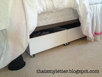 bedskirt hides storage and bed risers
