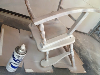 spray primer on rocking chair