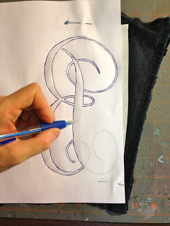 tracing the letter onto fabric