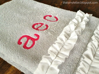 monogram on hand towel with ruffle detail