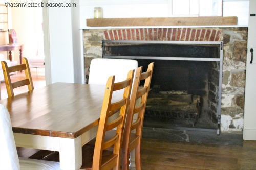 primitive farmhouse dining room stone fireplace