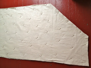 drop cloth pinned to quilt