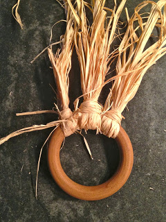 knot raffia bunch in place on ring