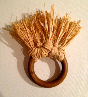 bunches of raffia wrapped onto curtain ring