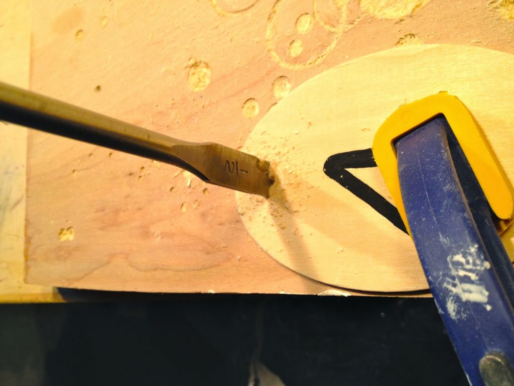 drilling a hole with a spade bit