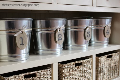 buckets with numbered wood tags for organized storage