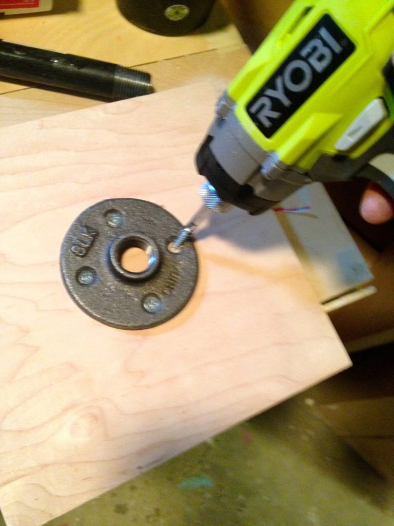 attach flange to plywood board base