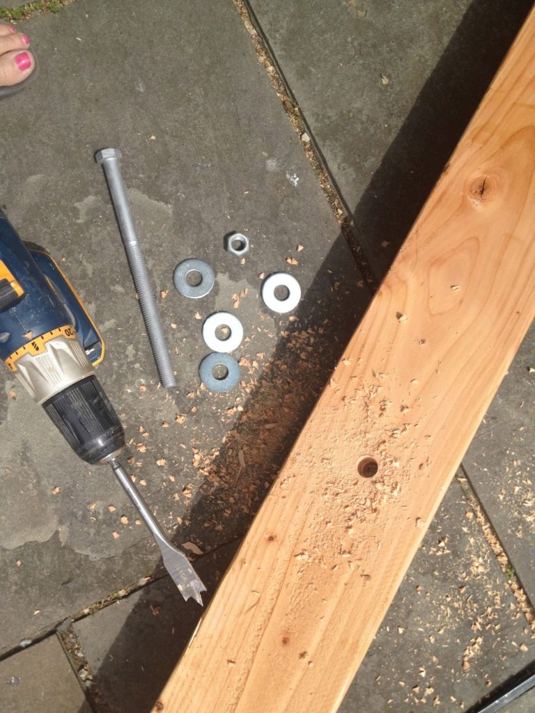 spade bit to drill holes through wood