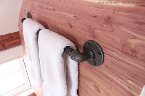 bathroom pipe towel bar cedar planked walls