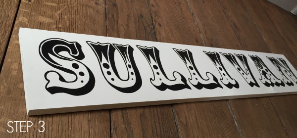 handpainted letters on wood sign