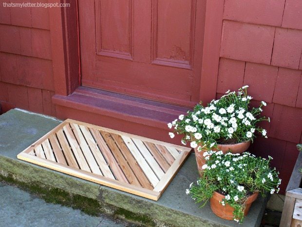 angled wooden door mat