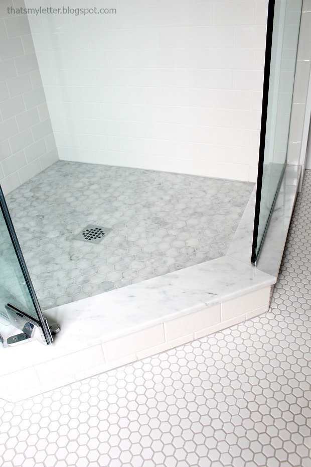 marble hexagon tile in master shower