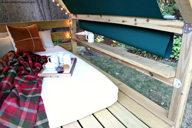 outdoor lounge cabana with fabric awning
