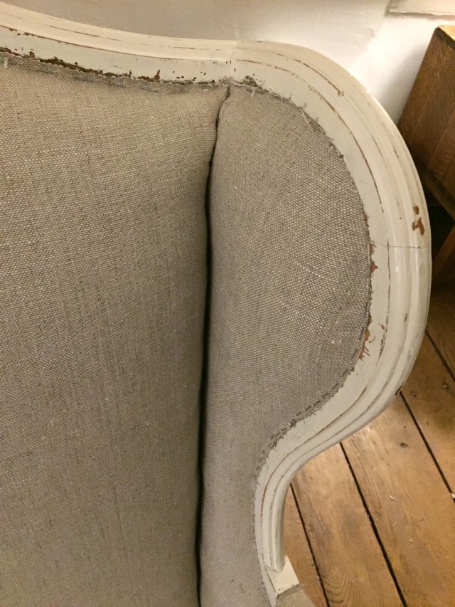staple edges of fabric to chair frame