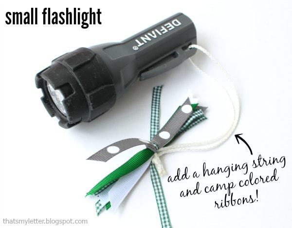 small flashlight with camp colored ribbons