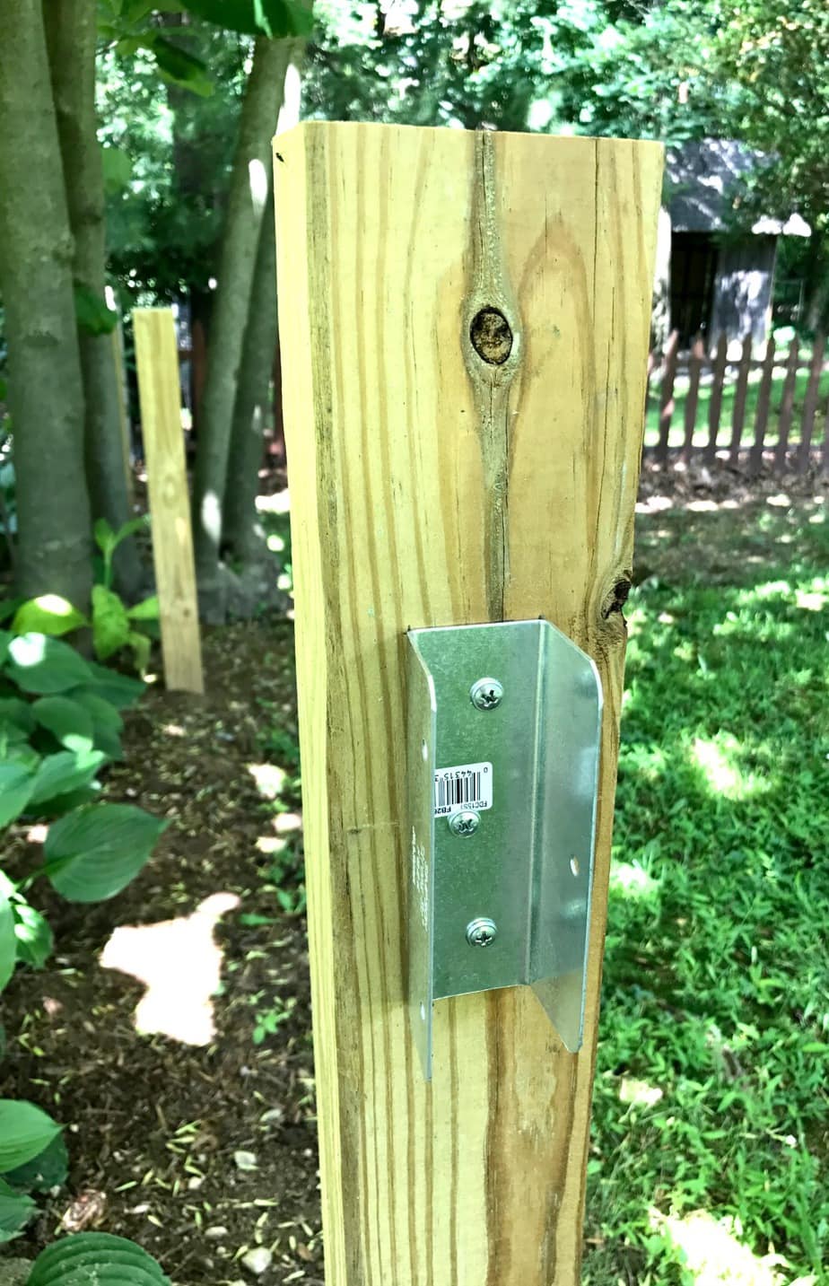 fence posts with connectors attached