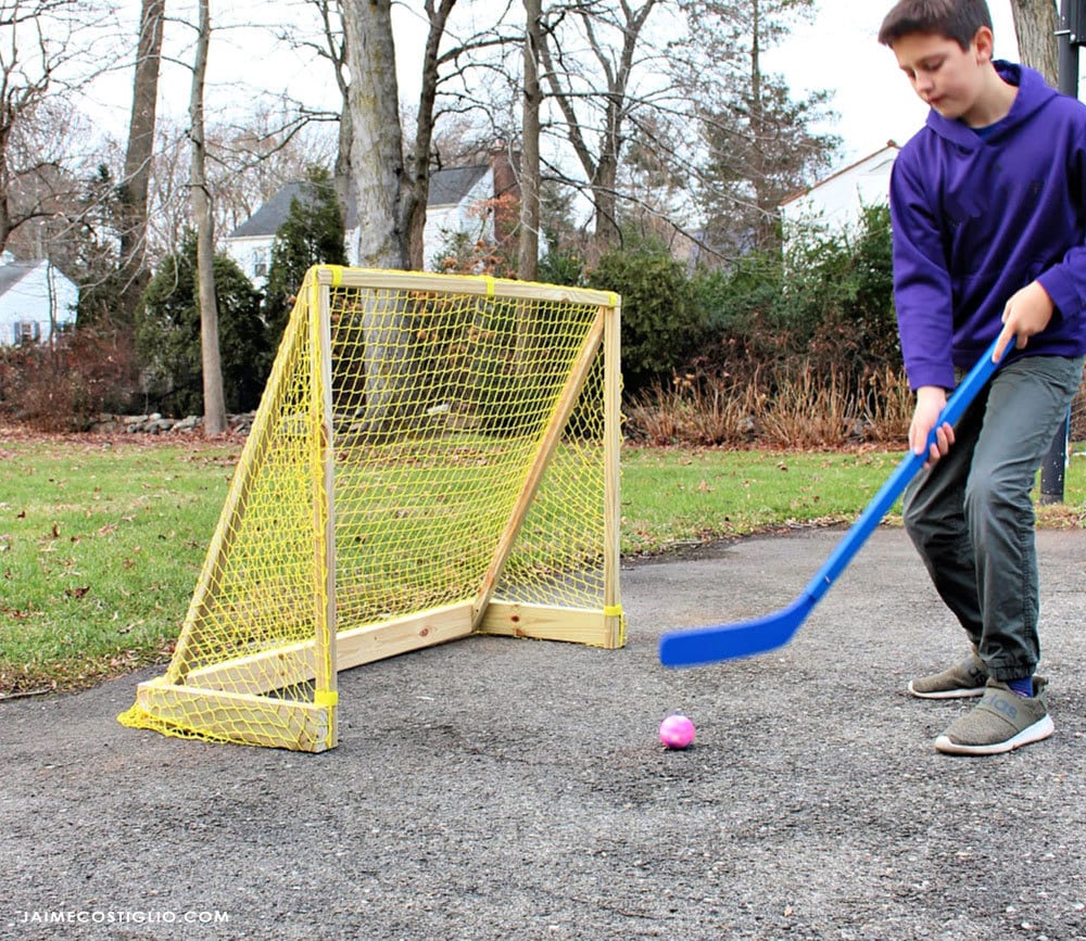 street hockey goal with boy