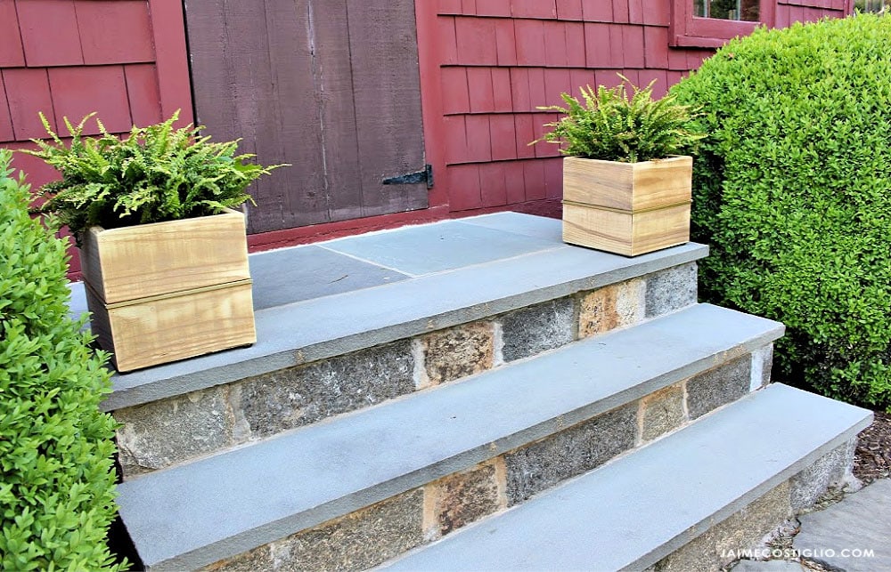 two wood planters on steps
