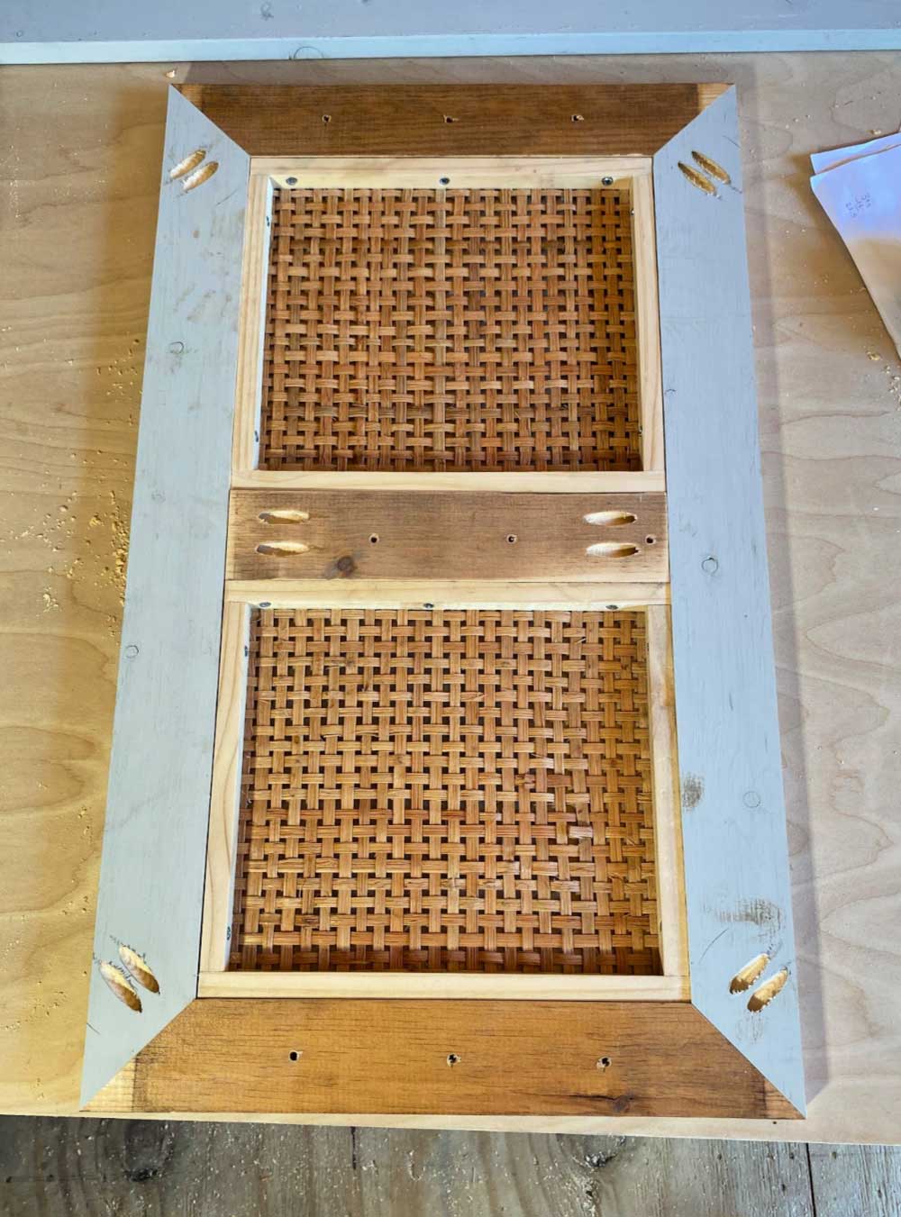 framed door with rattan panels