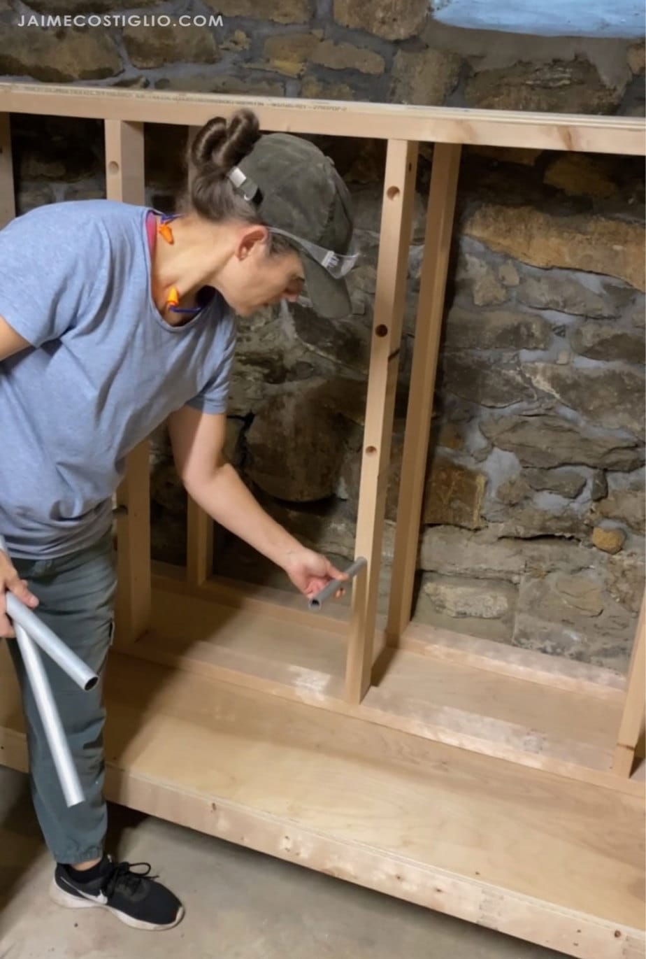 inserting conduit into lumber rack