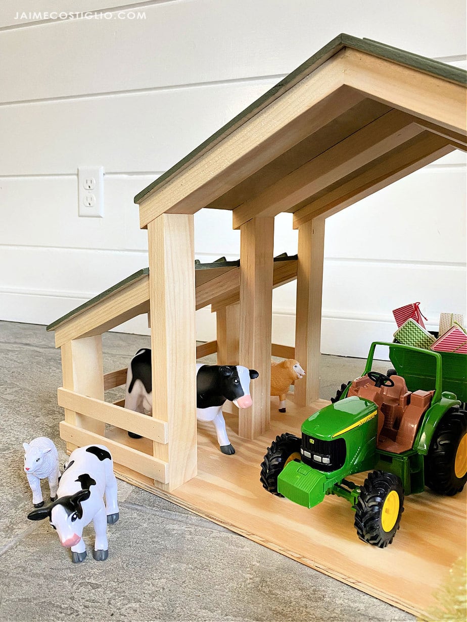 animals and tractor in barn