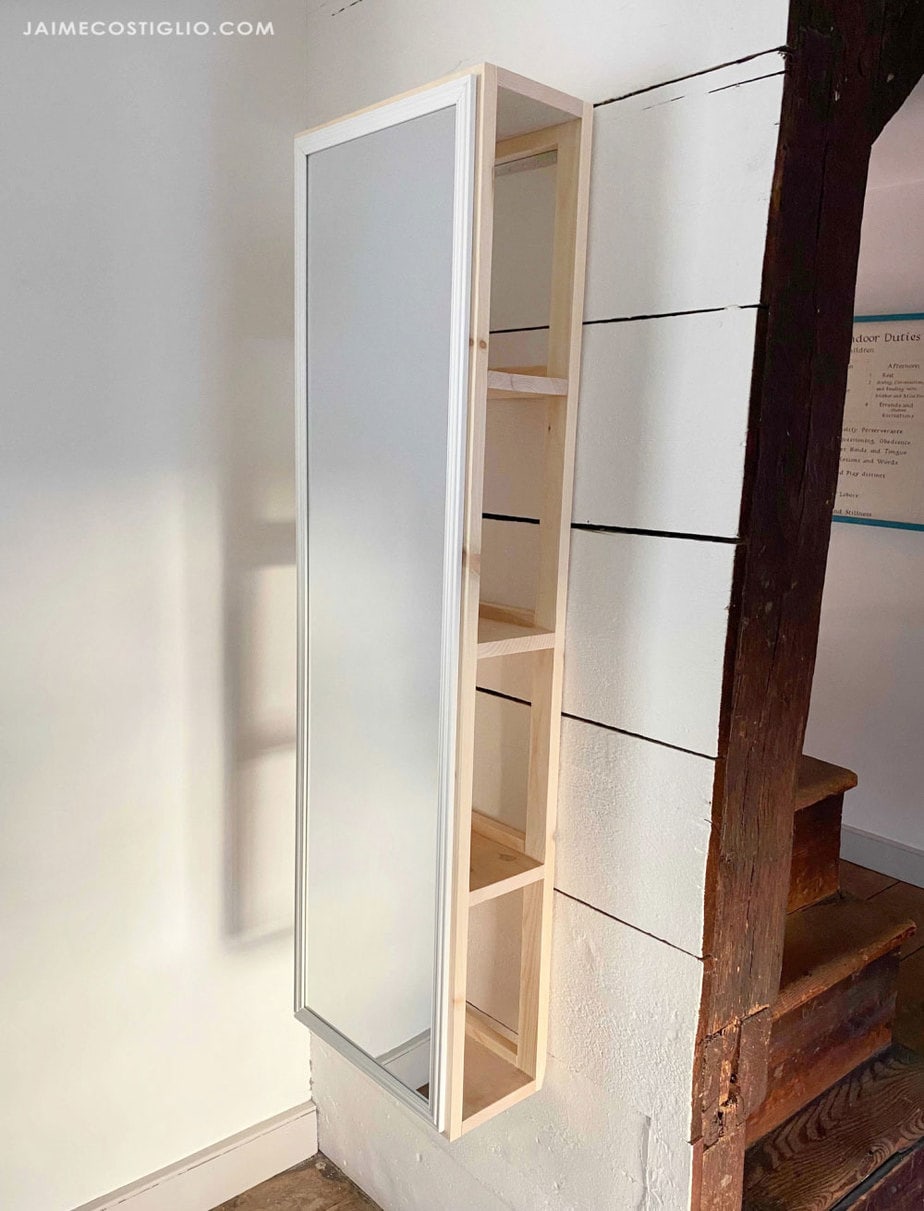 mirror on wall with storage