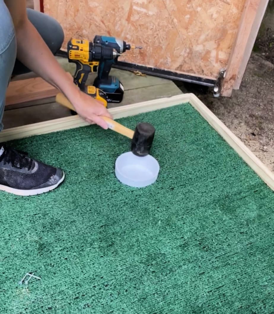 tapping pvc cap into hole with mallet