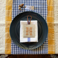 thanksgiving place setting with monogram ornament